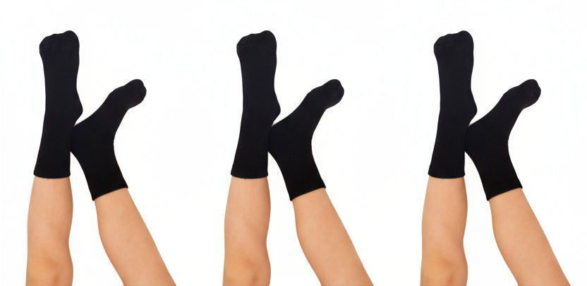 Three pairs of black seamless bamboo socks on white background
