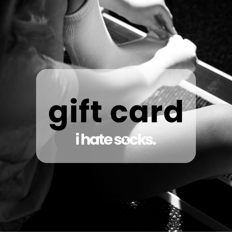 child putting on seam free sock. overlay saying gift card for i hate socks.