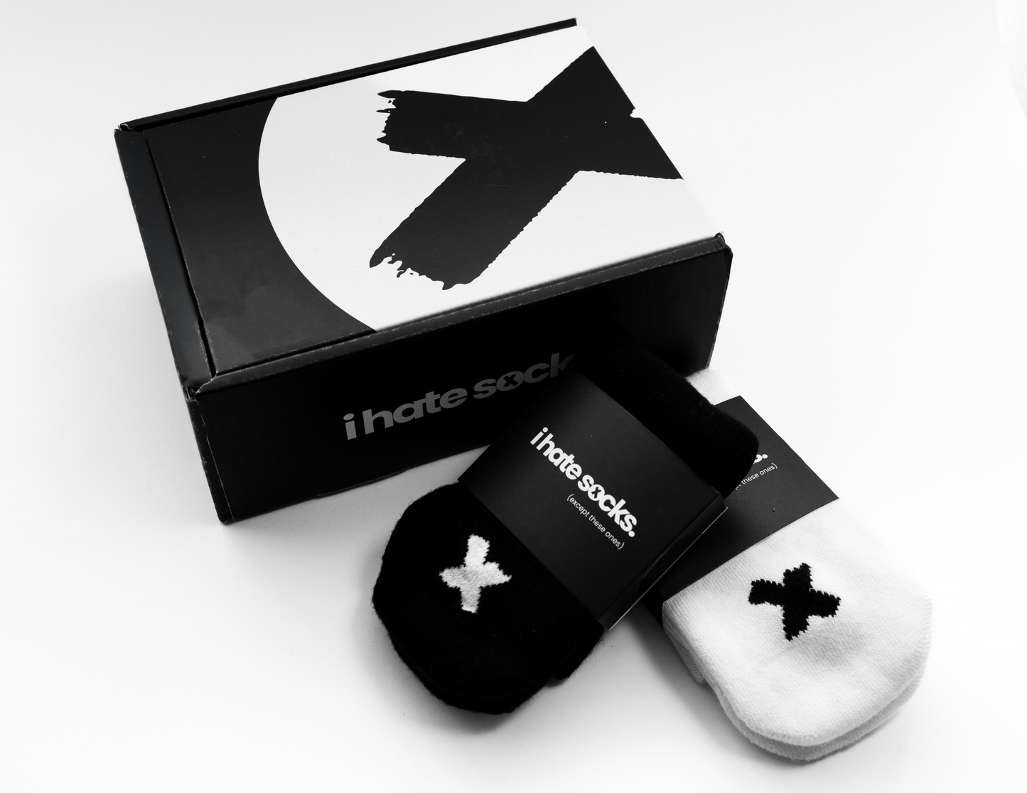 I hate sock box packaging with a black and white seam free pair of socks next to it.