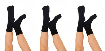 Three pairs of black seamless bamboo socks on white background