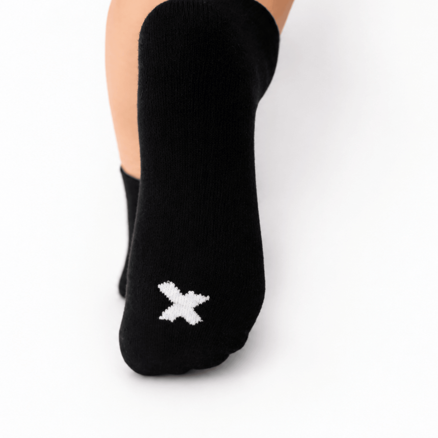 Cushioned sole and heel-free design of a black I Hate Socks sock